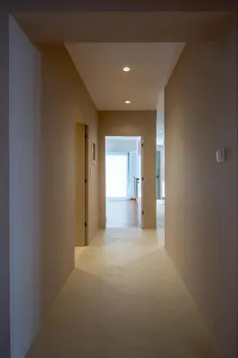 an empty hallway with a hallway leading into a room at Hippocrates - Faliro deluxe apartment in Athens