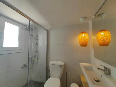 a bathroom with a toilet and a shower and a sink at Demetra - Koukaki center apartment in Athens