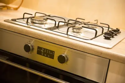 a white stove top oven sitting on a counter at Ivannas dream house in Athens