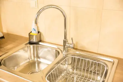 a sink in a kitchen with a faucet at Ivannas dream house in Athens