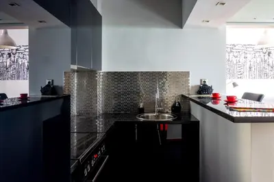 a kitchen with a sink and a counter top at The Burton Luxury 1BR in Plaka, Athens in Athens