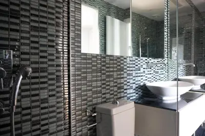 a bathroom with a sink and a toilet and a mirror at The Burton Luxury 1BR in Plaka, Athens in Athens