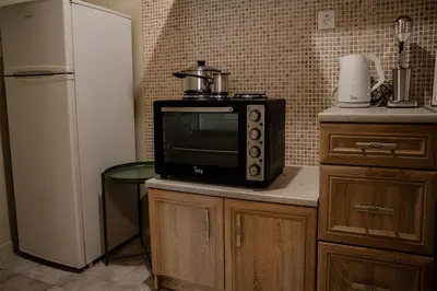 a microwave sitting on top of a counter in a kitchen at Your apartment in Athens (Next to Metro & Acropolis) in Athens