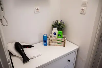 a bathroom counter with a white counter top at Your apartment in Athens (Next to Metro & Acropolis) in Athens