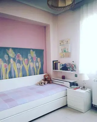 a bedroom with a bed with a painting on the wall at Fantastic villa, a 5 minute drive from the beach! in Athens