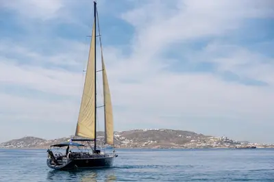 a sailboat with a large sail in the water at Boat Aiolis in the Athenian Riviera! in Athens