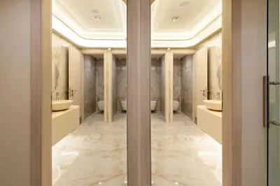 a bathroom with two sinks and two toilets at Green Suites Boutique Hotel in Athens