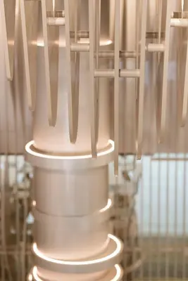 a stack of utensils hanging from a light fixture at Green Suites Boutique Hotel in Athens