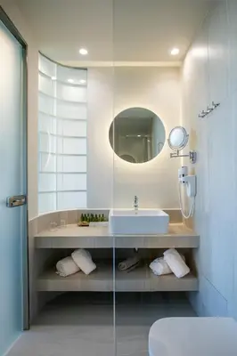 a bathroom with a sink and a mirror at Green Suites Boutique Hotel in Athens