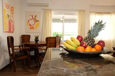 a bowl of fruit on a table in a room at Stylish Apartment, Acropolis view in Athens