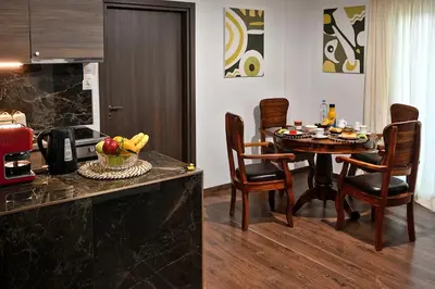 a kitchen and dining room with a table and chairs at Stylish Apartment, Acropolis view in Athens