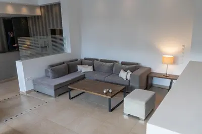 a living room with a couch and a coffee table at HOTEL HILL in Athens