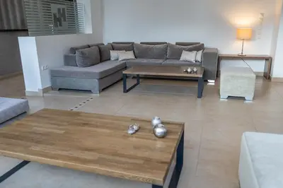 a living room with a couch and a coffee table at HOTEL HILL in Athens
