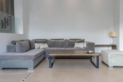a living room with a couch and a coffee table at HOTEL HILL in Athens