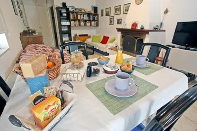 a table with food and coffee on top of it at House near the Athens Airport, Spata. in Spáta