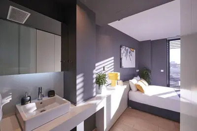 a bathroom with a sink and a bed and a mirror at Ma Maison No3 Downtown Loft,320Mbps,Acropolis Walk in Athens