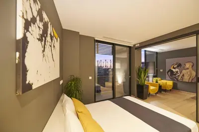 a bedroom with a bed and a living room at Ma Maison No3 Downtown Loft,320Mbps,Acropolis Walk in Athens