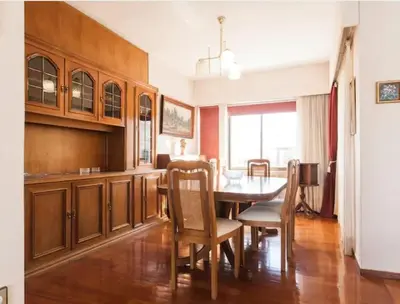 a kitchen and dining room with a table and chairs at Luxury Athenian Riviera Apartment 135 sqm at Voula in Athens