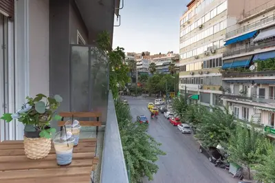 a balcony with a view of a city street at Elegant Apartment near Acropolis Walk to Plaka & Metro in Athens