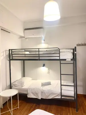a room with two bunk beds and a lamp at Athens City Themis 10 in Athens