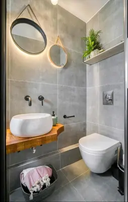 a bathroom with a white sink and a mirror at Acropolis stunning view Penthouse in Plaka for 2! in Athens