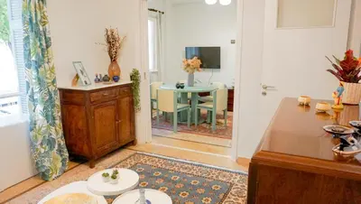 a living room with a table and a dining room at Comfortable Apartment in Kallithea by Athenian Homes in Athens