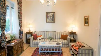 a living room with a couch and a table at A Happy Stay at Edem Beach by Athenian Homes in Athens