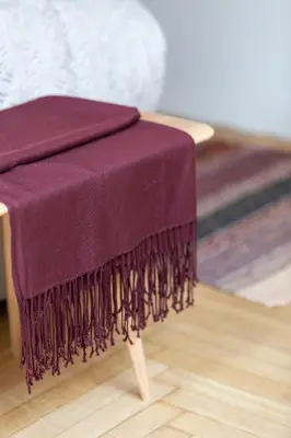 a purple blanket sitting on top of a table at A Short Walk to Syntagma and Plaka by Athenian Homes in Athens