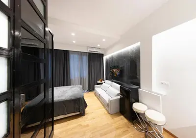 a bedroom with a bed and a living room at The Monastiraki Metro Lux Suite! in Athens