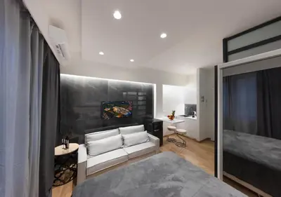 a living room with a white couch in a room at The Monastiraki Metro Lux Suite! in Athens