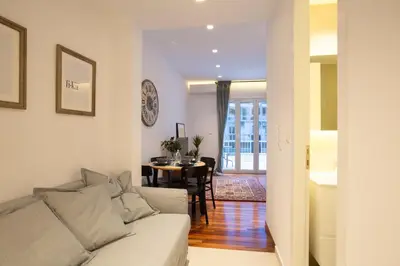 a living room with a couch and a table at Phaedrus Living: City Centre Luxury Flat Mavromichali in Athens