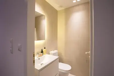a bathroom with a toilet and a sink and a shower at Phaedrus Living: City Centre Luxury Flat Mavromichali in Athens