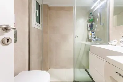 a bathroom with a shower and a toilet and a sink at Athens Perfect Spot - Zografou Cozy Home in Athens