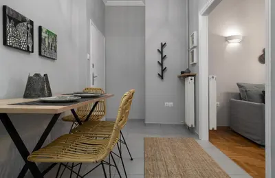a dining room with a table and chairs at Absolute Athens X in Athens