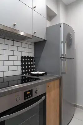 a kitchen with a stove and a refrigerator at Absolute Athens X in Athens