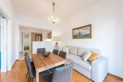 a living room with a table and a couch at Victoria Plaza Palace Apartments in Athens