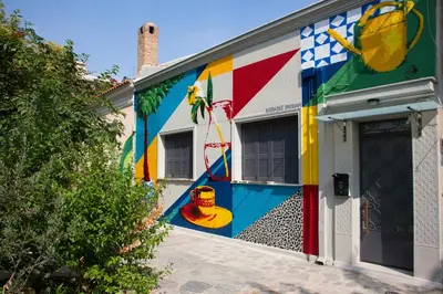a building with a colorful mural on the side of it at Vol.3 in Athens