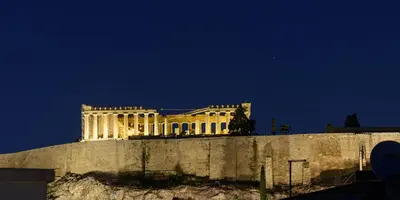 a white building on top of a hill at Acropolis View Penthouse in Athens