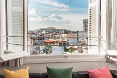 a window with a view of a city at Amazing Acropolis View from Exarcheia in Athens