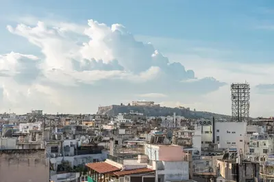a view of a city with buildings at Amazing Acropolis View from Exarcheia in Athens
