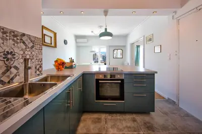 a kitchen with a sink and a counter top at Amazing Penthouse in Athens city center in Athens