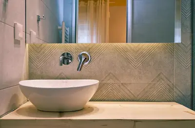a bathroom with a bowl sink on a counter at “Olympic Spirit” Apt in N. Kosmos neighbourhood in Athens