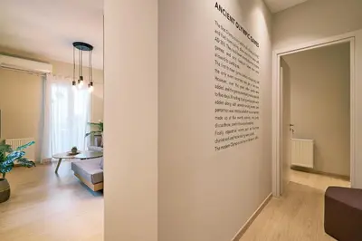 a room with a wall with writing on it at “Olympic Spirit” Apt in N. Kosmos neighbourhood in Athens