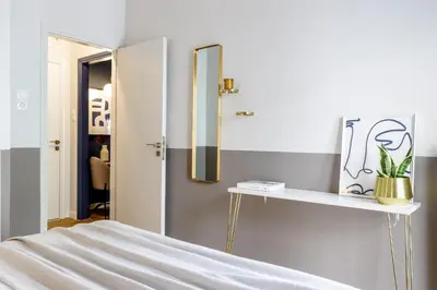 a bedroom with a mirror and a bed at Divine 1BR Apartment near the Acropolis museum in Athens