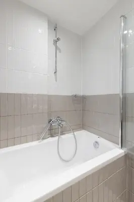a bathroom with a shower and a bath tub at Divine 1BR Apartment near the Acropolis museum in Athens