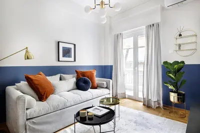 a living room with a couch and a table at Divine 1BR Apartment near the Acropolis museum in Athens