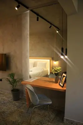 a desk with a chair and a bed in a room at La mouette apartment,Plaka, Athens in Athens