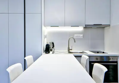 a kitchen with a white counter top and a sink at Boutique40 Luxury Apartment in Athens