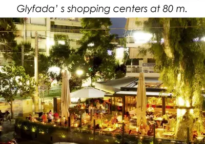 a restaurant with umbrellas in a city at night at Boutique40 Luxury Apartment in Athens
