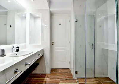 a bathroom with a glass shower and a sink at Boutique40 Luxury Apartment in Athens